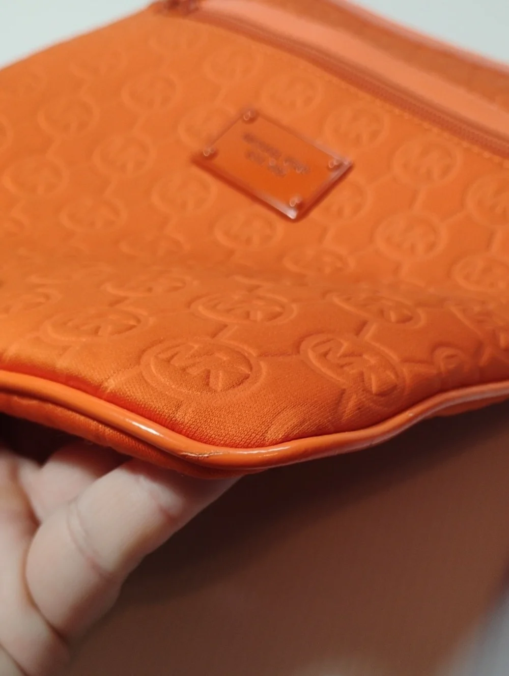 Michael Kors Neoprene Tangerine Mono Embossed Swing Crossbody bag